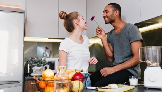 loving-couple-t-shirts-flirting-kitchen-husband-gives-his-wife-beautiful-flower-happy-faces-nice-gift-healthy-eating-happy-pair_197531-1615