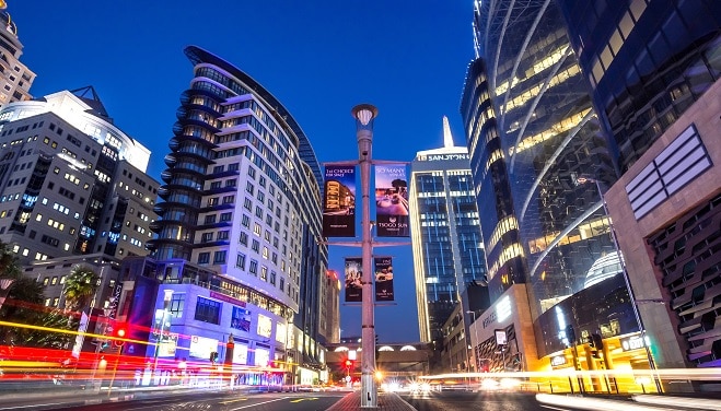 Johannesburg, South Africa, March 29-2018: Long exposure of busy city street with modern buildings in skyline.